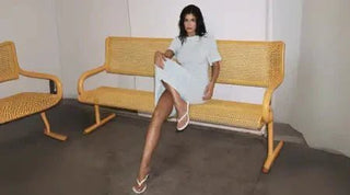 Summer party dresses in light blue with a sleek design, styled with white flip-flops for a casual yet chic look