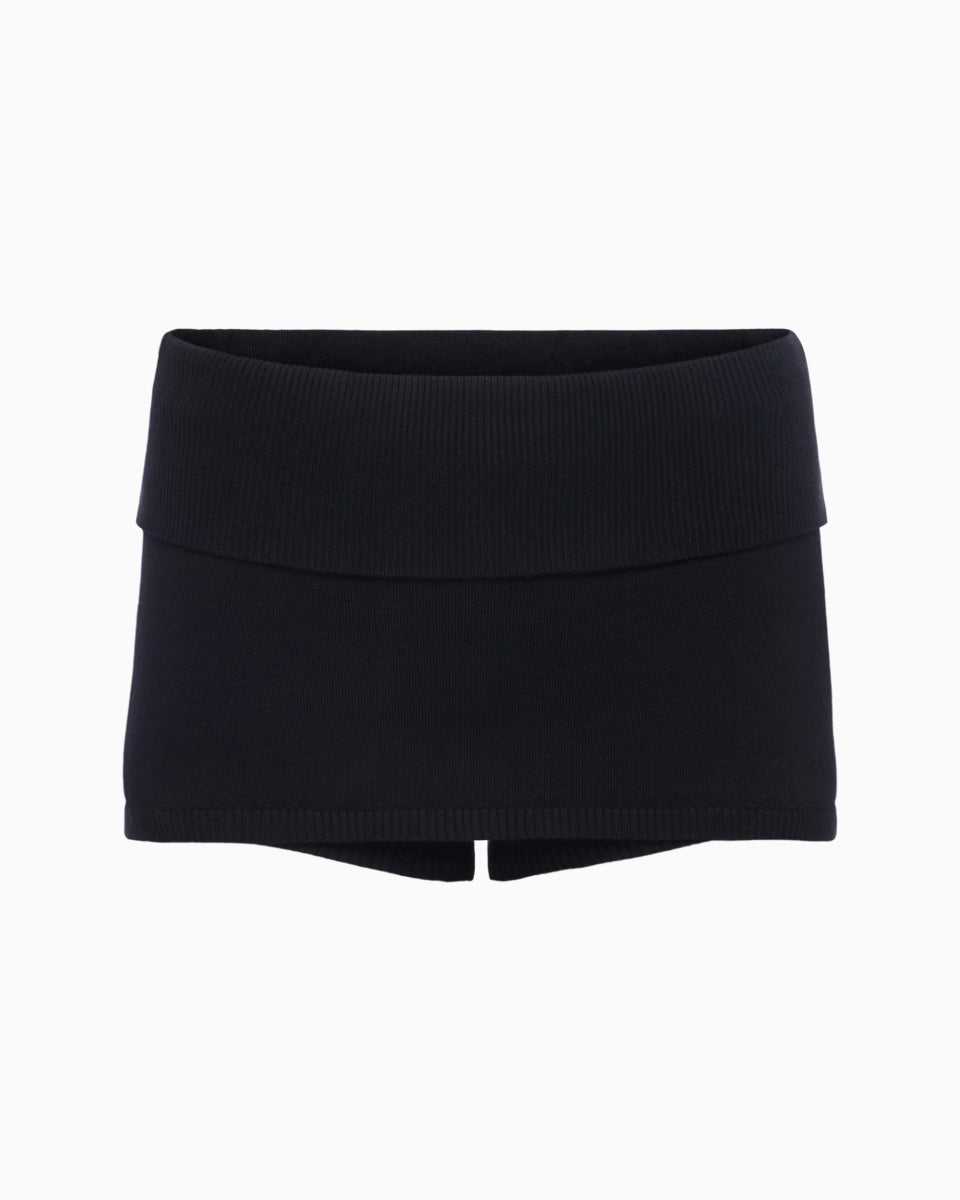 Black mini skort with wide ribbed waistband and subtle front slit detail on a white background.