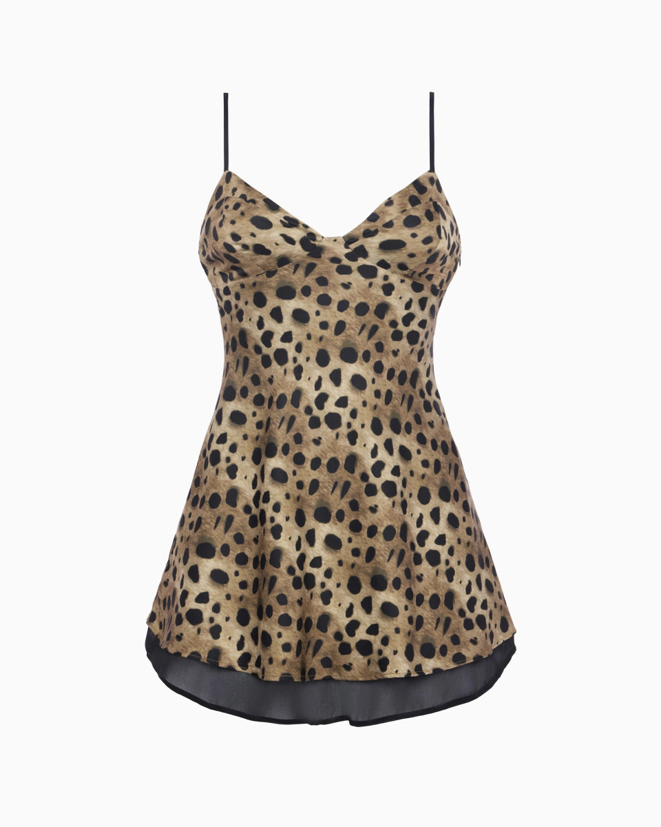 Leopard satin dress with black spaghetti straps, flared mini silhouette, and sheer black hem detail.