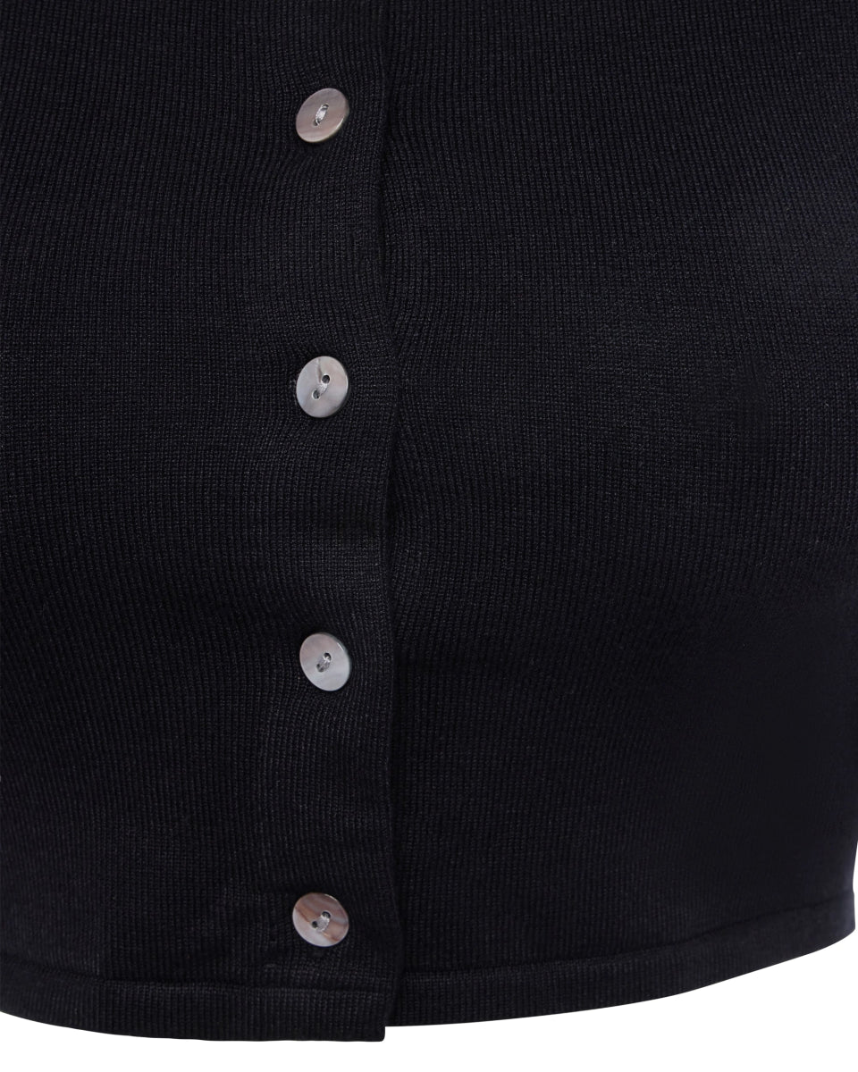 Black knit button up with silver buttons shown in a close-up view highlighting ribbed texture and front seam.